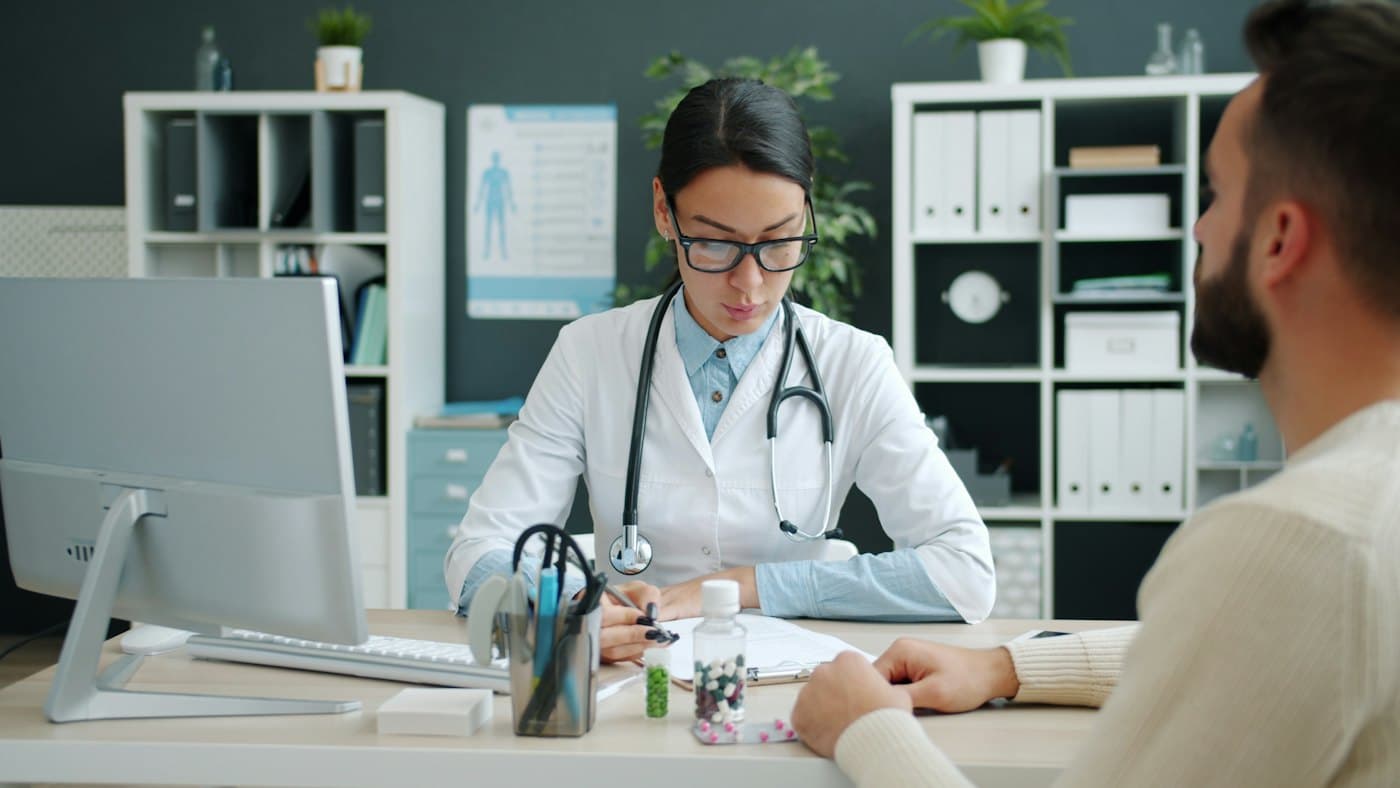 A provider taking notes during an appointment